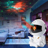 Astronauta proyector de galaxias